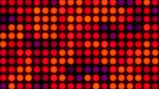 Warm red and orange LED light grid background. Glowing circular dots pattern for stage, disco, or holiday event video backdrops.