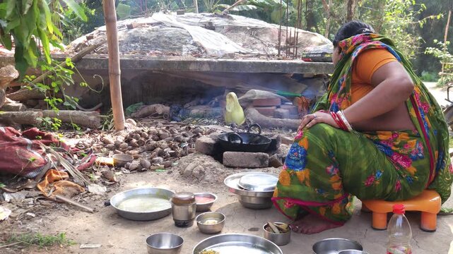 Rural Indian Woman Cooking Outdoors in Traditional Village Kitchen, Preparing Food on Wood Fire Chulha, Authentic Indian Lifestyle, Culture and Rural Life