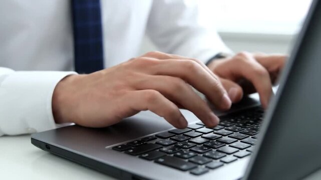 Professional Typing on Laptop Computer