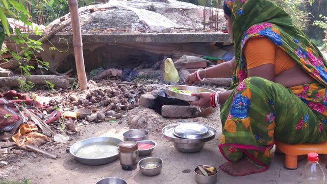Rural Indian Woman Cooking Outdoors in Traditional Village Kitchen, Preparing Food on Wood Fire Chulha, Authentic Indian Lifestyle, Culture and Rural Life