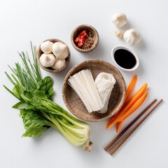 Fresh Ingredients for Asian Cuisine with Noodles, Vegetables, and Sauces on White Background