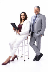 Business people working on digital tablet and smiling