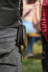 Leather belt pouch worn at outdoor event