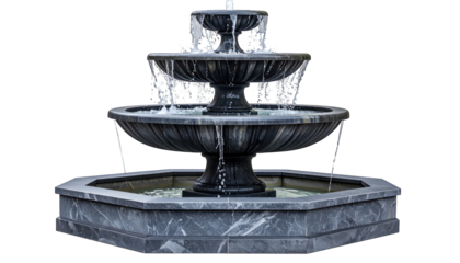 Classic tiered fountain with flowing water, constructed of dark stone, isolated