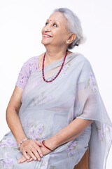 Portrait of beautiful senior woman on white background