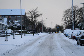 Aberdeen Scotland 3rd January 2025 Snow covered main road with in a snowy neighbourhood background. 