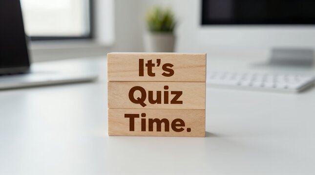 office desktop scene with wooden blocks displaying its quiz time motivational message
