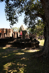 Stone temple built with local stone and rocks with colourful painted statues and carvings with beautiful weathered rocks
