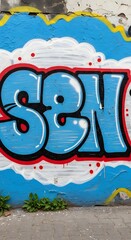 Vibrant graffiti artwork featuring bubble letters in bold colors on a textured exterior wall