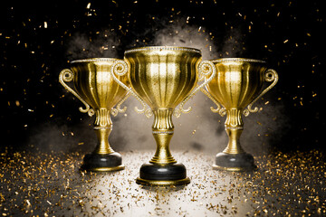 Gold winner's cups as a reward. Award for outstanding achievements. Winners' cup. Achievements. Victory. Goal achievement concept. Winner's certificate. First place in a computer game. 3D rendering.