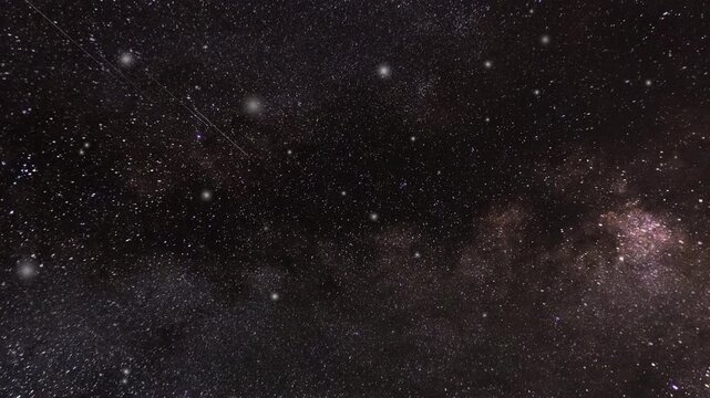 Abstract glittering star particles texture in dark night sky animation