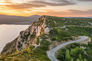 Aerial view of the picturesque Route de Crete road between Cassis and La Ciotat during sunset, southern France.