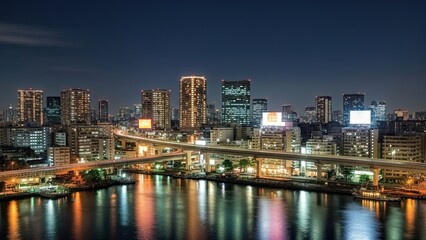 Obraz premium San Diego skyline at night features urban skyscraper architecture and city lights reflecting over the harbor water during a beautiful twilight dusk panorama