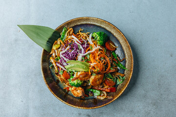 Fresh wok bowl with vegetables nuddles and shrimps