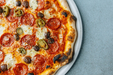 Fresh artisan Salami pizza with olives