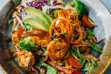 Fresh wok bowl with vegetables nuddles and shrimps