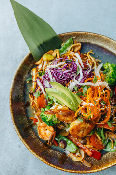 Fresh wok bowl with vegetables nuddles and shrimps