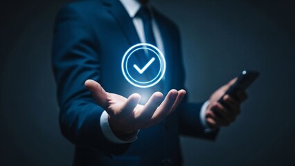 Businessman in a dark suit holding a smartphone with a glowing checkmark icon representing digital verification and successful transaction completion in a modern corporate setting