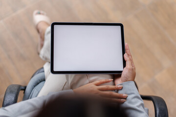 Mockup blank screen digital tablet, business woman hands holding, using tablet with empty screen for online marketing or mobile app design.
