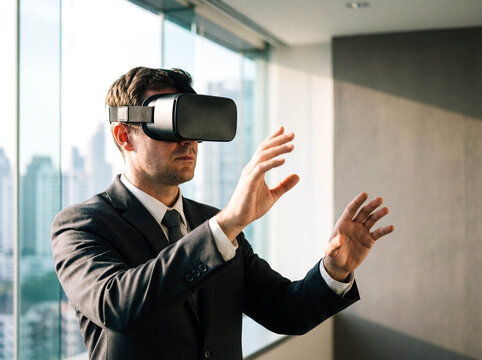 Professional man in virtual reality glasses working in office technology future digital interface innovation business background copy space simulation cyber - Powered by Adobe