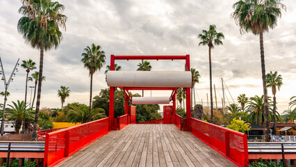Bridge crossing the road leading to the port of Barcelona from the promenade, Spain.