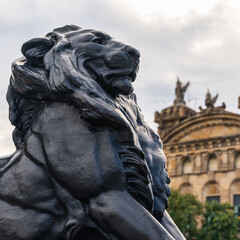 Majestic lion statue in Columbus Square in the city of Barcelona.