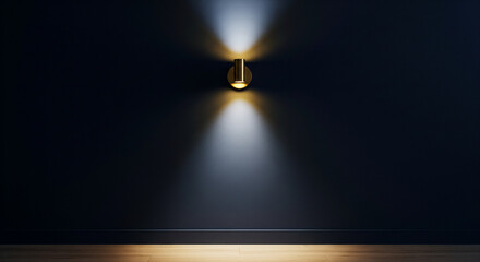 A modern gold sconce emitting a warm light beam upwards and downwards on a dark navy blue wall