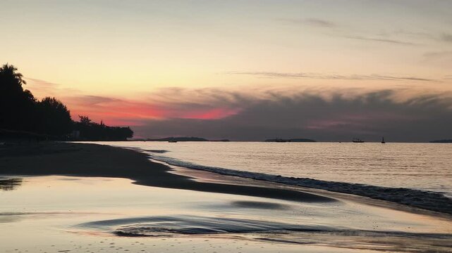 Gentle ocean waves roll toward the shore in the fresh morning air