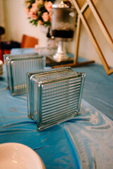 Elegant Glass Blocks Decorate a Blue Buffet Table