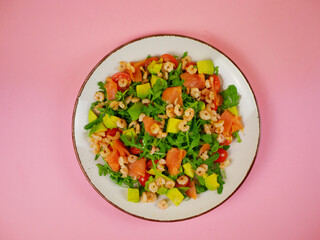 Top view colorful salmon shrimp avocado arugula salad arranged neatly for a healthy step by step recipe illustration with balanced ingredients. pro photo