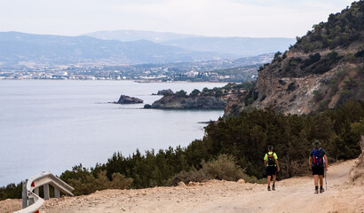 Hikers walking coastal trail in akamas peninsula cyprus