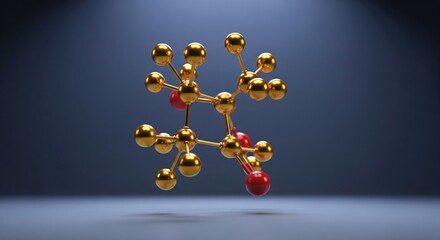 Gold molecular structure model with red spheres on dark gradient background, lit from above