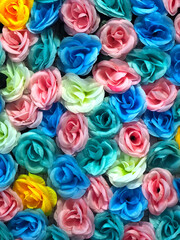 bunch of colorful fabric roses background 