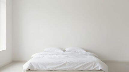 Serene minimalist bedroom with low white bed natural light and empty walls