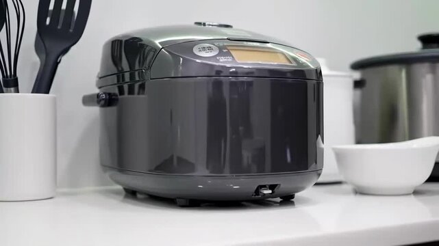 Modern Kitchen Appliance Showcase Featuring an Electric Rice Cooker And Kitchen Utensils Arranged