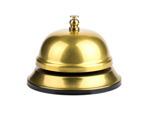 Close-up of a shiny, golden service bell with a black base against a pure black background
