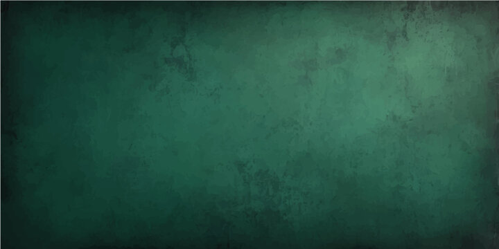 Vintage green chalkboard background with a dark grunge texture and old rough concrete surface design for a blank wallpaper backdrop