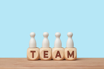 Teamwork and collaboration concept with wooden blocks and figures