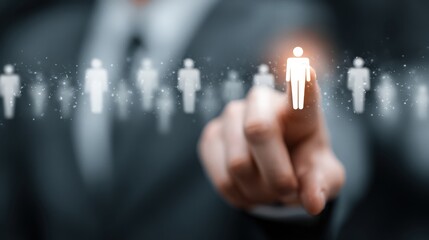 Group of human figures with one person highlighted, suggesting selection or focus in a business or professional setting