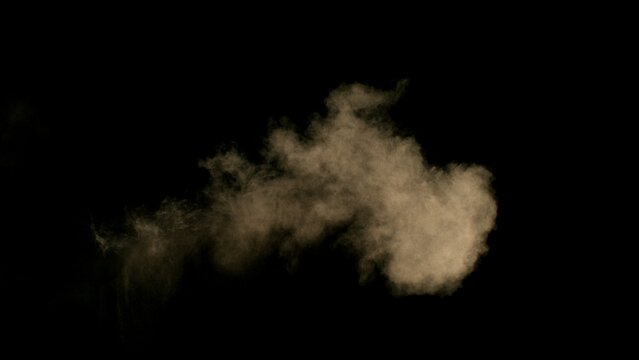 Freeze Motion Shot of Flying Sand Dust , Isolated on Black Background