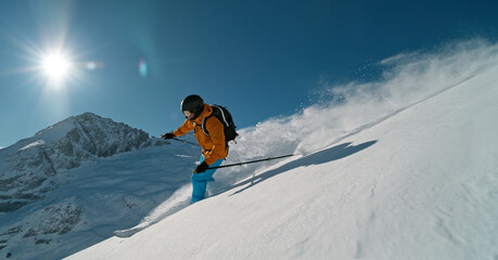 Skier riding in the scenic Dolomites mountains in fresh po . Super slow motion at 1000 fps.