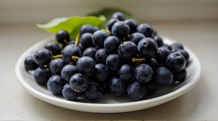 black corinthian grapes on a white plate