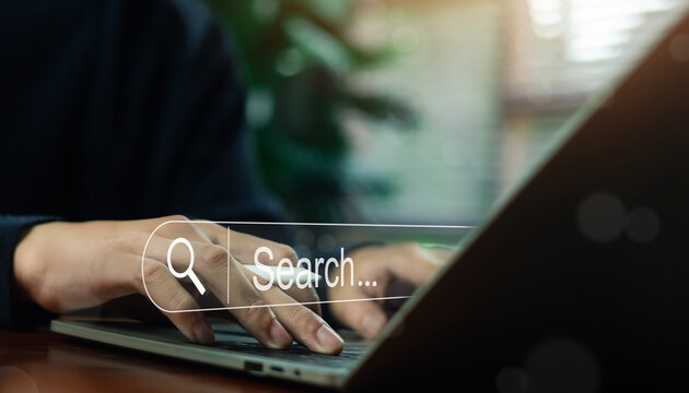 Business professional using laptop computer with search bar interface on screen, concept of online search, SEO strategy, digital marketing, data research, internet technology. - Powered by Adobe