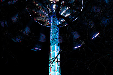 Spinning Amusement Ride with Colorful Lights at Night