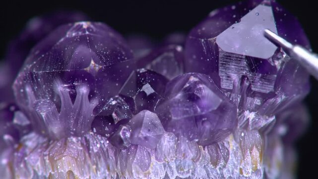 Close up of amethyst crystals and tool showing fine detail