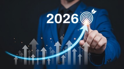 Businessman setting 2026 goals with target arrow and growth chart