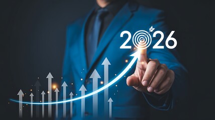 Businessman setting 2026 goals with target symbol