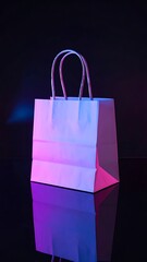 White paper bag with handles stands on a reflective black surface under pink and blue neon lighting