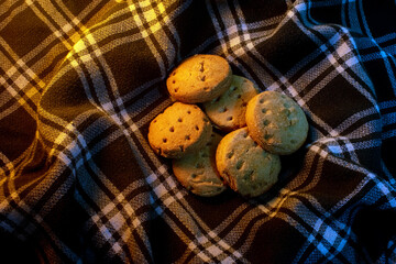 Round Cookies with Warm Ambient Lighting. Conveying cozy home baking, autumn comfort, and family moments.