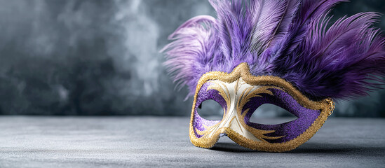 Colorful traditional carnival mask decorated with feathers placed on a wooden table, minimal festive composition with copy space suitable for carnival design and celebration themes.